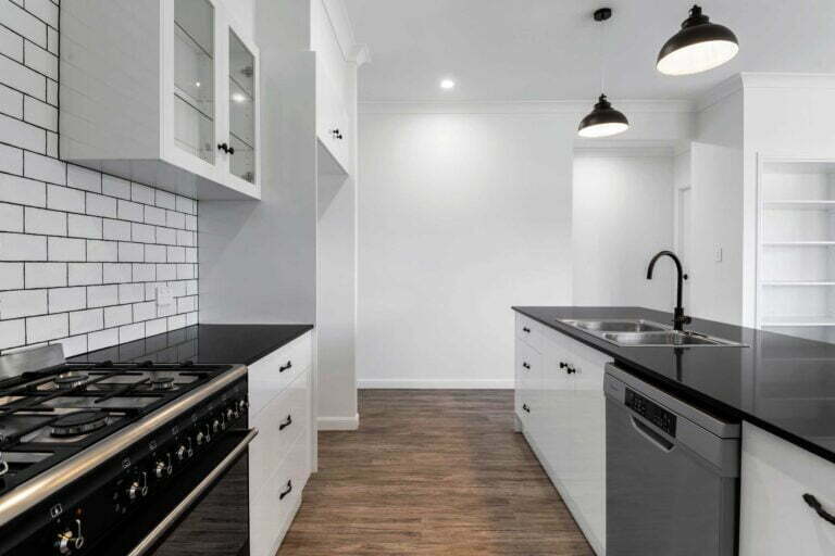 This kitchen is great for a family that cooks together. There is extra wide space between the cooktop and breakfast bar so that food prep, cleaning, serving can be done separate or while cooking is happening. Pendant lights help provide a very well lit cooking and food prep area. Perfect for a family that loves to cook.